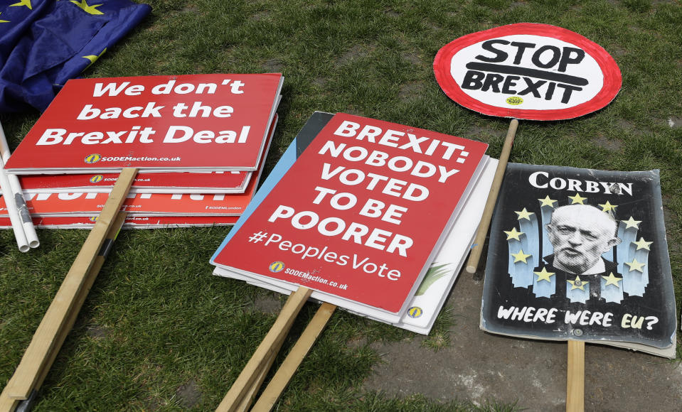 Banners lie on the ground near Parliament in London, Wednesday, May 22, 2019. British Prime Minister Theresa May was under pressure Wednesday to scrap a planned vote on her tattered Brexit blueprint — and to call an end to her embattled premiership — after her attempt at compromise got the thumbs-down from both her own Conservative Party and opposition lawmakers. (AP Photo/Kirsty Wigglesworth)