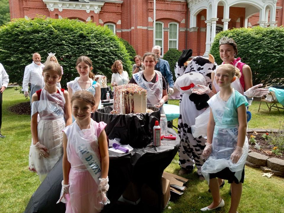 Wayne County Dairy Misses, clockwise around the ice cream starting in front are Everly Zablocky, Trudy Zablocky, Zoey Tyler, Kenley Roberts and Chloe Tyler. In back at right is Alternate PA Dairy Princess Natalie Grumbine.