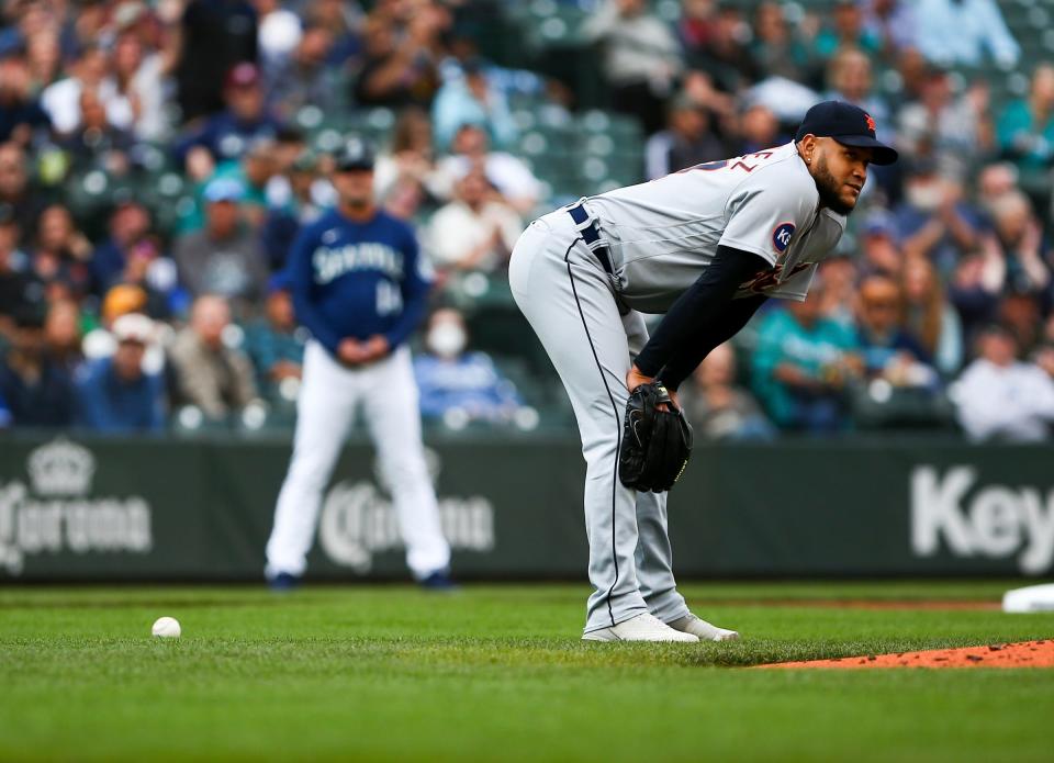 Tigers pitcher Eduardo Rodriguez looks up after bobbling the ball to allow Mariners center fielder Jarred Kelenic a single during the second inning in the first game of a doubleheader on Tuesday, Oct. 4, 2022, in Seattle.