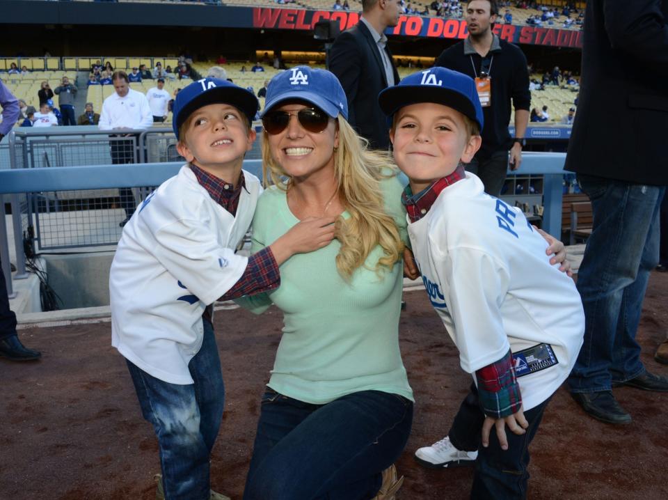 Britney Spears poses with sons Jayden James Federline and Sean Federline at Dodger Stadium in 2013.