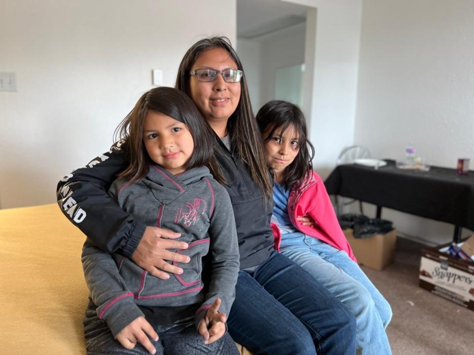Isabelle Sunrise with her her daughters Des (left) and Piper (right). The family evacuated from their home on May 14.  (Carla Ulrich/CBC - image credit)