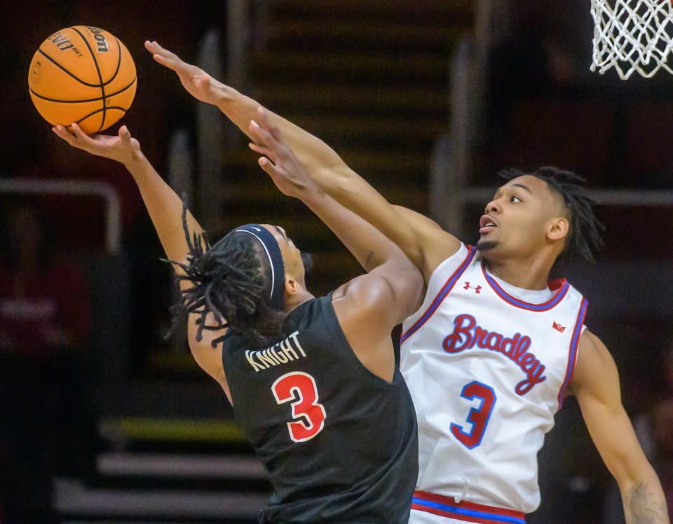 Bradley's Zek Montgomery, right, defends against Illinois State's Seneca Knight in the first half Wednesday, Jan. 25, 2023 at Carver Arena. The Braves downed the Redbirds 79-75 in overtime.