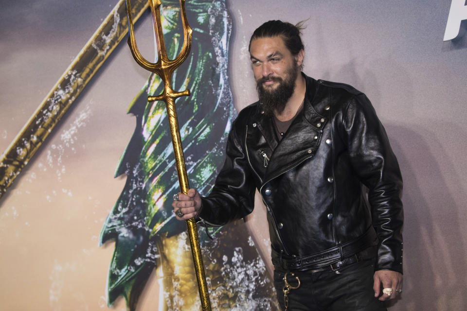 Jason Momoa poses for photographers upon arrival at the world premiere of the film 'Aquaman', in London, Monday, Nov. 26, 2018. (Photo by Vianney Le Caer/Invision/AP)