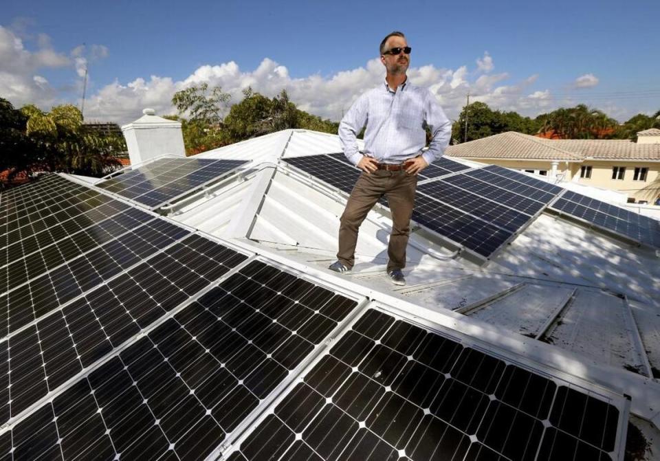 Surfside Mayor Daniel Dietch on the roof of his home powered by solar panels on Thursday, November 12, 2015.