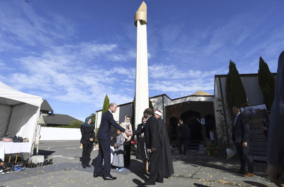 Britain's Prince William, second left, and New Zealand Prime Minister Jacinda Ardern, center, arrive at the Al Noor mosque in Christchurch, New Zealand, Friday, April 26, 2019. Prince William visited the one of the mosques where 50 people were killed and 50 others wounded in a March 15 attack by a white supremacist. (Tracey Nearmy/Pool Photo via AP)