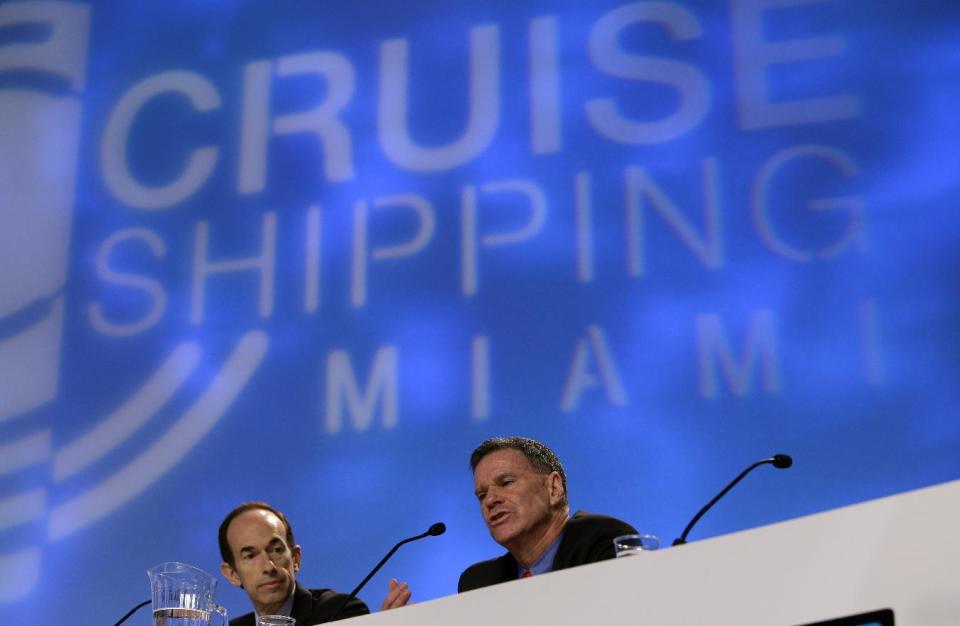 Gerry Cahill, right, president and CEO of Carnival Cruise Lines, speaks during the State of the Industry session at the 29th annual Cruise Shipping Miami conference, Tuesday, March 12, 2013, in Miami Beach, Fla. Carnival Cruise Line’s highest priority is to look at “learnings and potential changes” that can be made after the Triumph stranding last month, said Cahill. At left is Adam Goldstein, president and CEO of Royal Caribbean International. (AP Photo/Lynne Sladky)