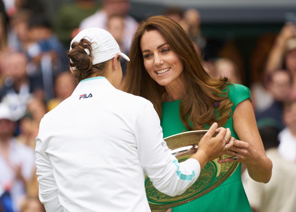 Ashleigh Barty is presented with the Venus Rosewater Dish by Princess Kate after beating Karolina Pliskova in the Wimbledon Championship's women's final in London on July 10, 2021.