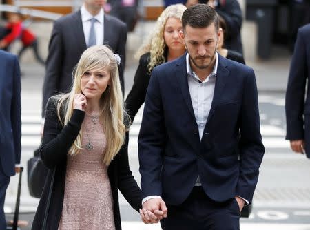 Charlie Gard's parents Coonie Yates and Chris Gard arrive at the High Court ahead of a hearing on their baby's future, in London. REUTERS/Peter Nicholls