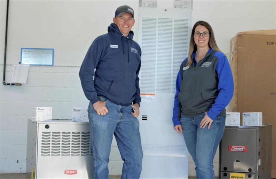 Steve and MIchelle Robbins of Robbins Heating & Air Conditioning in Farmington pose with the three heaters and carbon monoxide detectors that will be installed in the homes of San Juan County families by next week.
