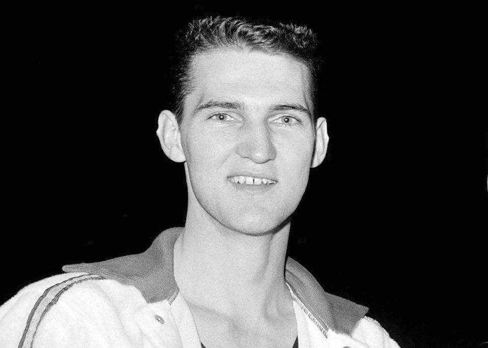 FILE - West Virginia basketball player Jerry West poses at New York's Madison Square Garden, March 26, 1960. Jerry West, who was selected to the Basketball Hall of Fame three times in a legendary career as a player and executive and whose silhouette is considered to be the basis of the NBA logo, died Wednesday morning, June 12, 2024, the Los Angeles Clippers announced. He was 86. (AP Photo/Marty Lederhandler, File)