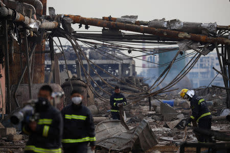 Firefighters work on the site following an explosion at a pesticide plant owned by Tianjiayi Chemical, in Xiangshui county, Yancheng, Jiangsu province, China March 22, 2019. Yang Bo/CNS via REUTERS