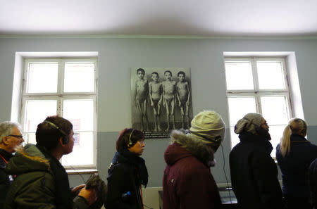 Visitors walk through a museum in the former Nazi German concentration and extermination camp Auschwitz in Oswiecim January 26, 2015. REUTERS/Laszlo Balogh