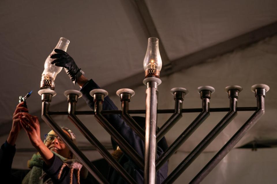 The Jewish festival of Hanukkah is celebrated with lighting eight-armed candelabras, or menorahs (Aaron Chown/PA) (PA Wire)