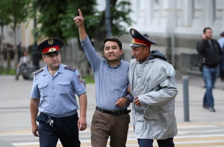 Kazakh opposition supporters hold a rally in Almaty