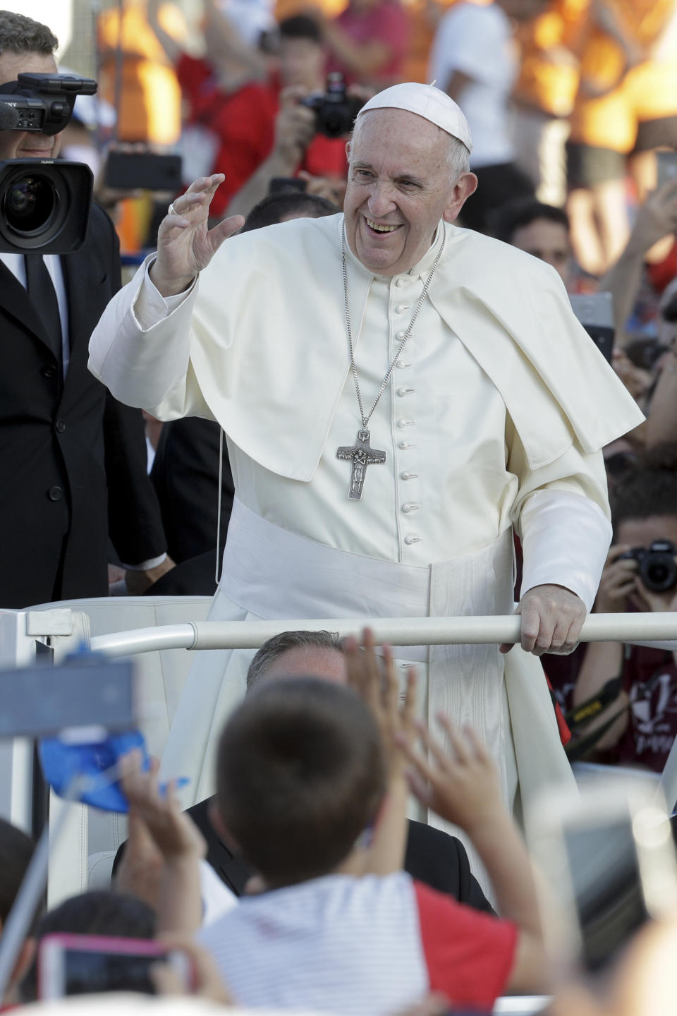 Pope Francis arrives at Rome's Circus Maximus to lead an evening prayer vigil with youths, Saturday, Aug. 11, 2018. Thousand of youths gathered for the meeting with the pontiff in preparation for the next World Youth Day that will be held in Panama next year. (AP Photo/Andrew Medichini)