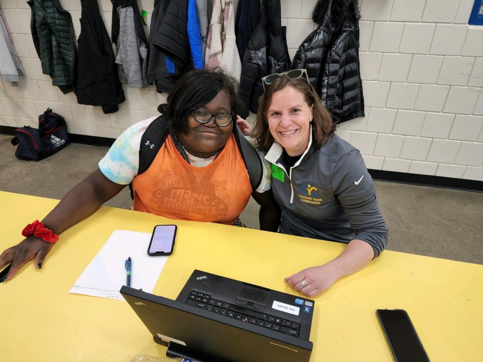 Bryanna Hall, a sophomore at Northern Kentucky University, (left) poses with Amy Thompson, CEO of the Cincinnati Youth Collaborative. Hall has been a part of the Saturday Hoops program since she was 15 years old. Saturday Hoops is celebrating its 20th anniversary.