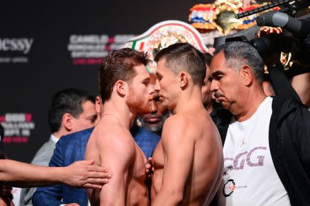 Sep 14, 2018; Las Vegas, NV, USA; Canelo Alvarez (left) and Gennady Golovkin face off during weigh ins for a middleweight world title boxing match at T-Mobile Arena. Mandatory Credit: Joe Camporeale-USA TODAY Sports