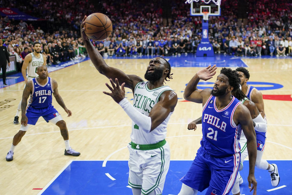 Boston Celtics' Jaylen Brown shoots against Philadelphia 76ers' Joel Embiid (21) during the first half of Game 6 of an NBA basketball playoffs Eastern Conference semifinal, Thursday, May 11, 2023, in Philadelphia. (AP Photo/Matt Slocum)