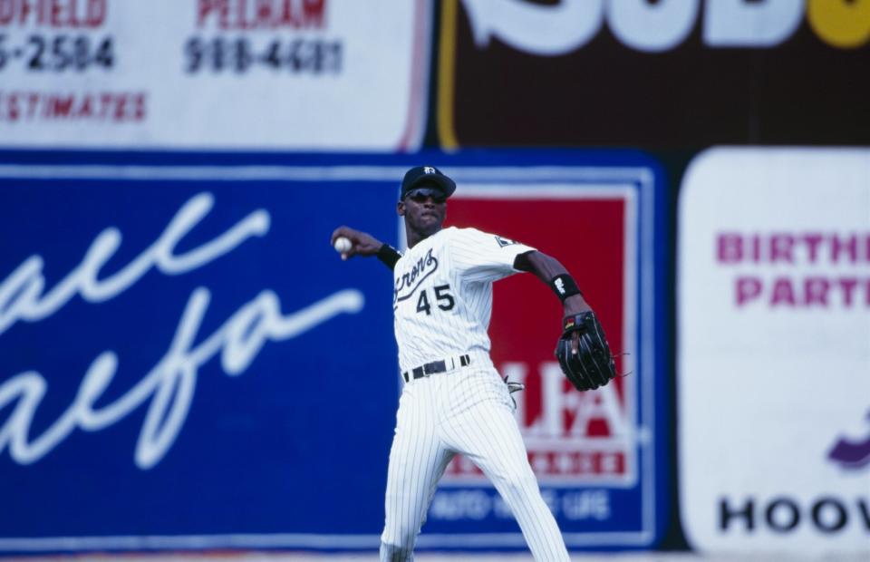Michael Jordan makes a throw while playing for the Birmingham Barons during a game in 1994 against the Memphis Chicks at Hoover Metropolitan Stadium in Hoover, Ala.
