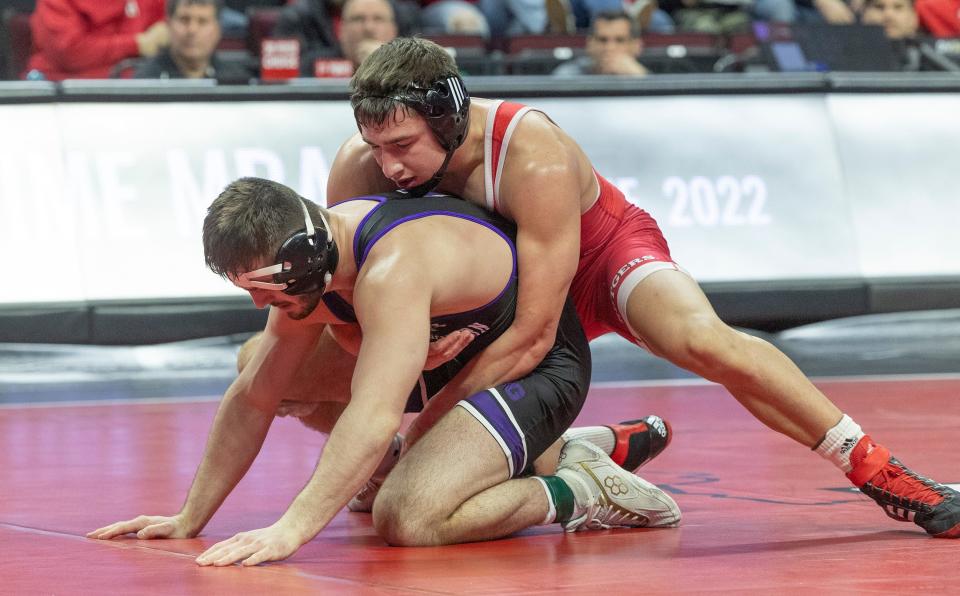 Robert Kanniard (top), shown wrestling Northwestern's Maxx Mayfield on Jan. 29, came through a big win for Rutgers in its win at Maryland Saturday.