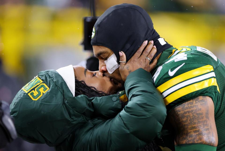 PHOTO: Olympic gold medalist Simone Biles kisses husband Jonathan Owens #34 of the Green Bay Packers before the game between the Kansas City Chiefs and the Green Bay Packers at Lambeau Field on December 03, 2023 in Green Bay, Wisconsin. (Stacy Revere/Getty Images)