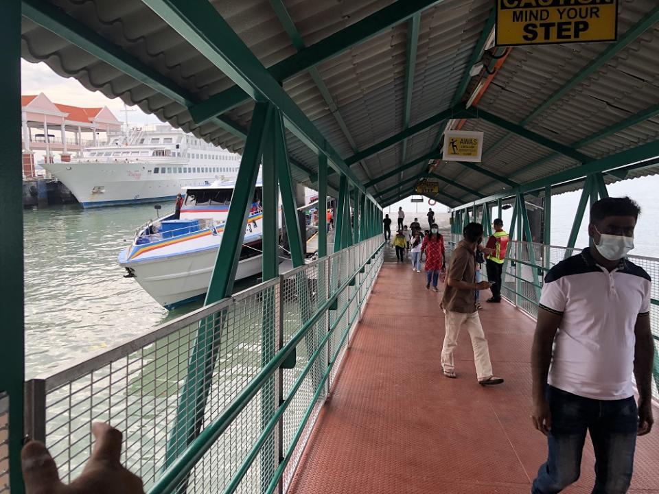 Passengers alighting from the fast boat at Swettenham Pier Cruise Terminal in George Town January 1, 2020.