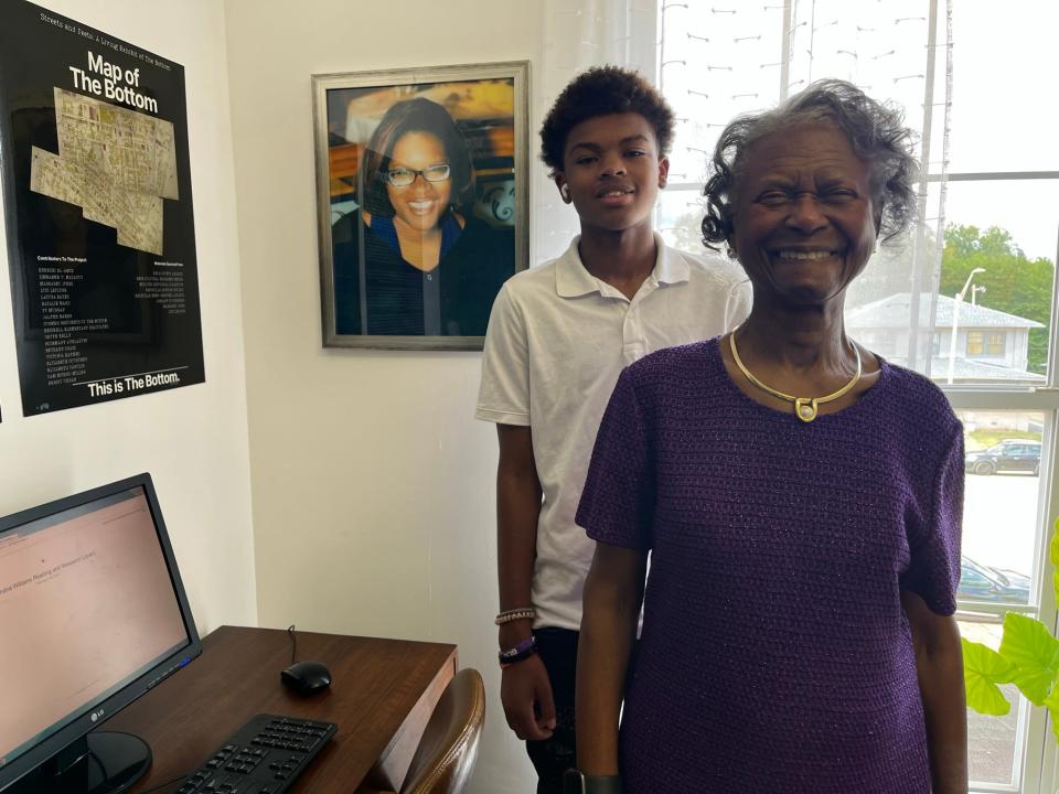 Elandria’s family: nephew Nevyn Williams and mother Elnora Williams pose with a portrait of Elandria Williams, whose life and legacy are celebrated in the newly opened Elandria Williams Reading and Research Room at The Bottom.