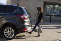 This undated photo provided by Ford shows the hands-free-opening liftgate for the Escape SUV. Power liftgates come in handy but are largely offered as a feature on an upper trim level or an extra-cost option on wagons and SUVs. (Ford Motor Co. via AP)