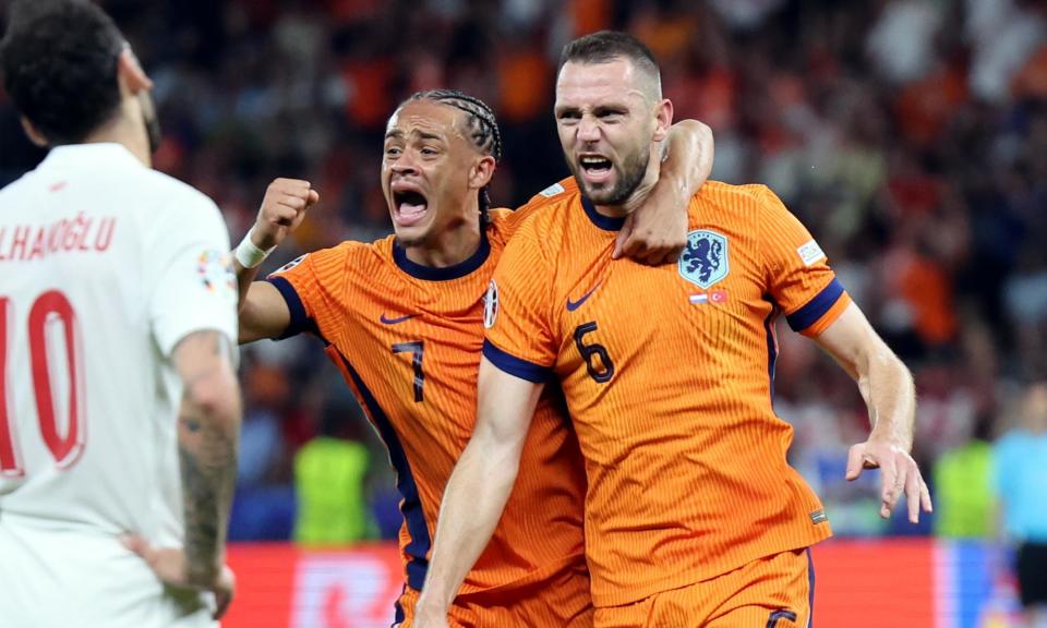 <span>Stefan de Vrij (right) celebrates his equaliser with Netherlands teammate Xavi Simons.</span><span>Photograph: Abedin Taherkenareh/EPA</span>