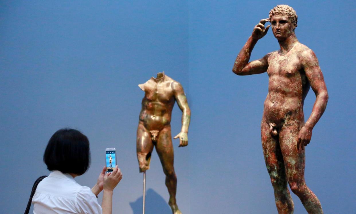 <span>The Greek bronze was discovered by fishers off Pesaro, on Italy’s Adriatic coast, in 1964.</span><span>Photograph: Nick Ut/AP</span>