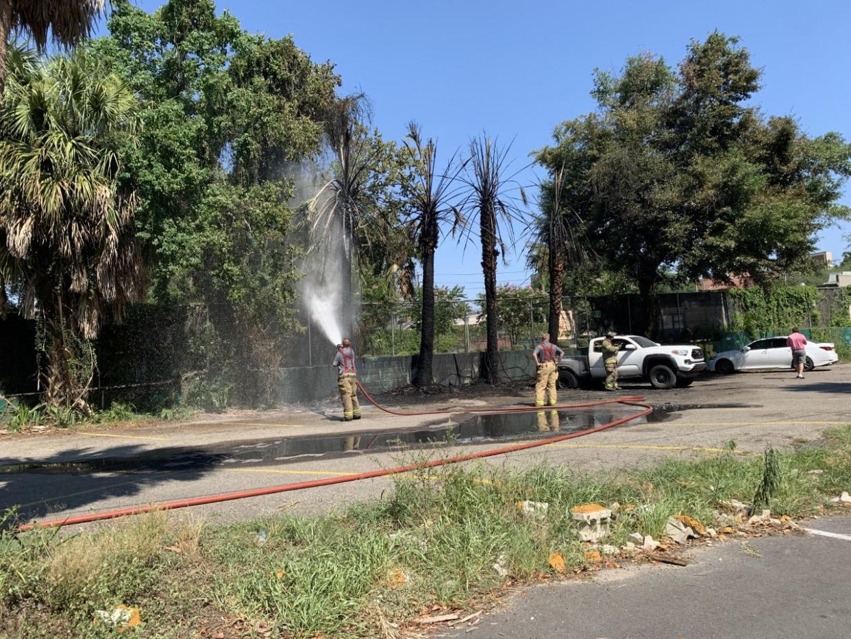 The scene a little over an hour after a fire in the parking lot of Poor Paul's Poorhouse and Bullwinkle's Saloon left two vehicles destroyed, Wednesday, June 22, 2022.