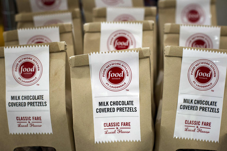 In this Wednesday, Nov. 14, 2012 photo, bags of the Food Network Kitchen's Milk Chocolate Covered Pretzels appear on display at the Fort Lauderdale-Hollywood International Airport, in Fort Lauderdale, Fla. (AP Photo/J Pat Carter)
