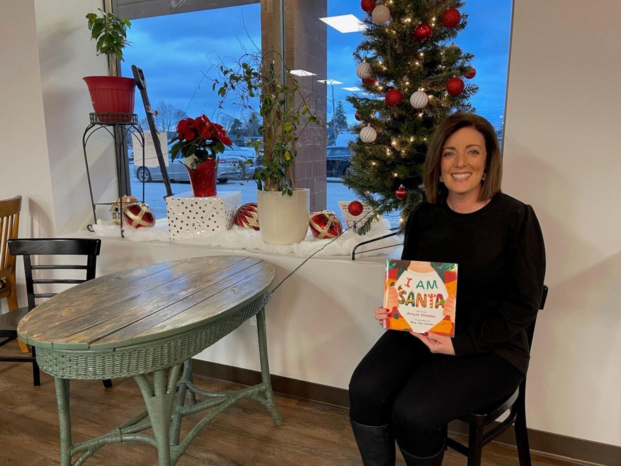 Local author Amyjo Sharder discusses her holiday book "I am Santa" at Werner Books in Erie.