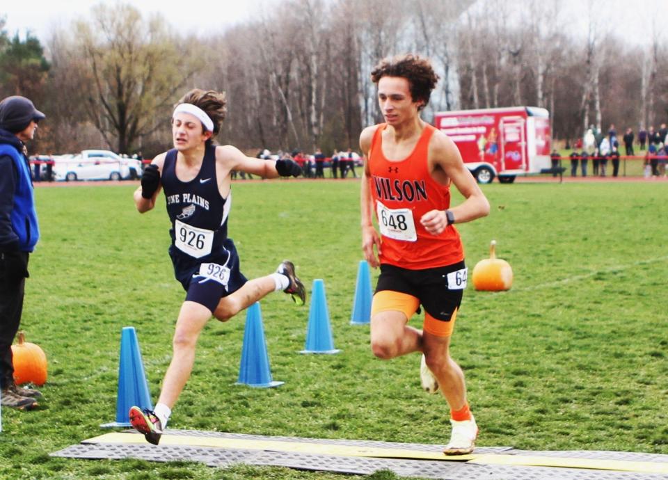 Pine Plains' Dan McPherson (l) can't quite out-lean Wilson's Jayden Ruble, who beats him by .01, during the boys Class D state cross-country championship race Nov. 11, 2023 in Verona, New York.
