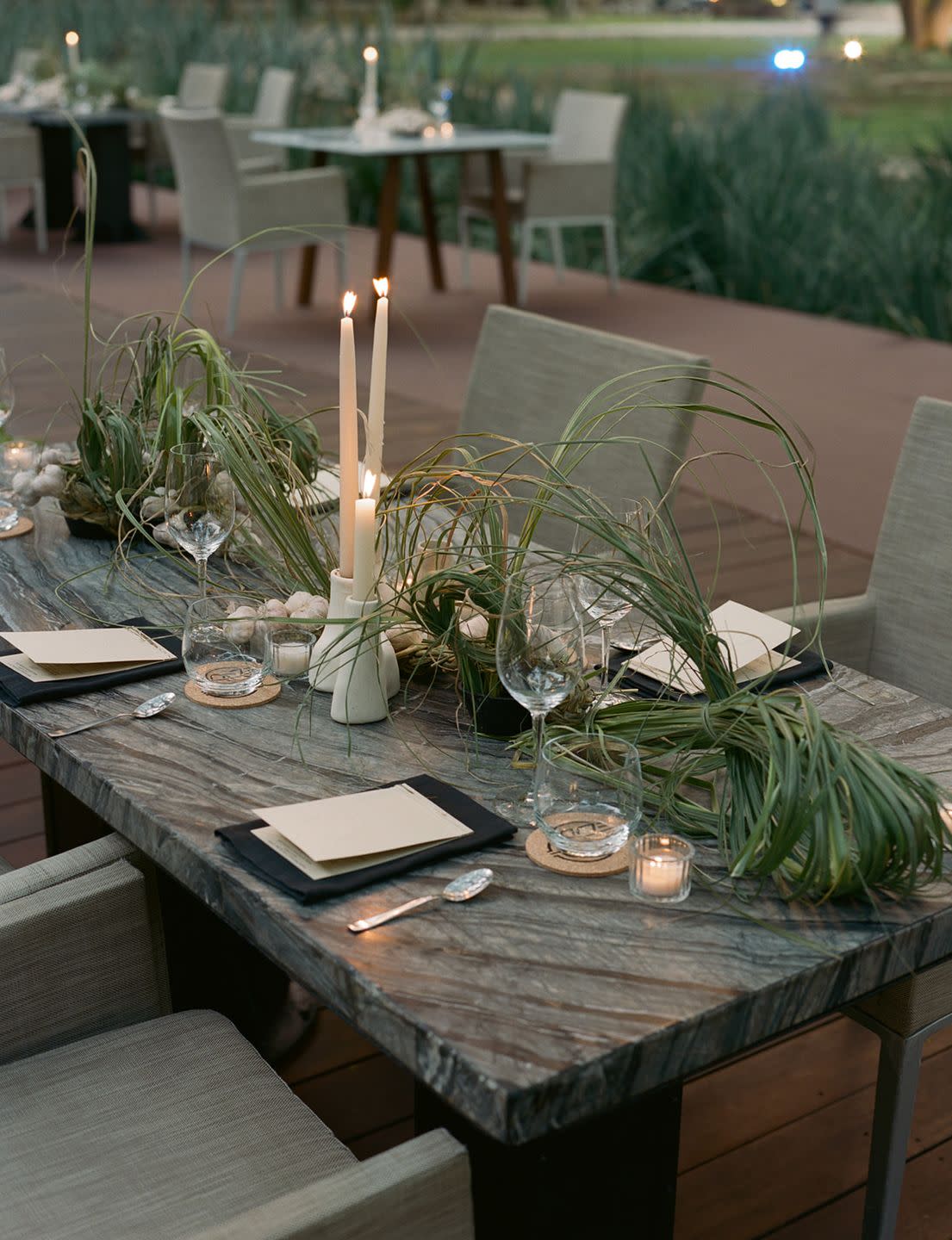 a table with candles and glasses on it