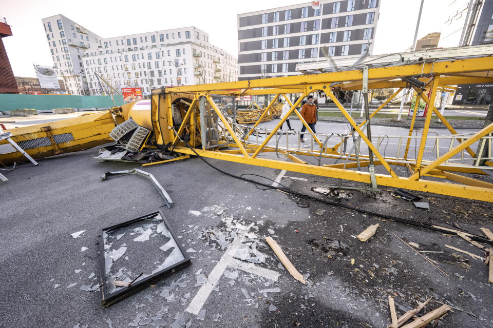 A construction crane lay after crashing in central Malmo, Sweden, Sunday Jan. 30, 2022, after a powerful winter storm swept through northern Europe over the weekend. Storm Malik was advancing in the Nordic region on Sunday, bringing strong gusts of wind, and extensive rain and snowfall in Denmark, Finland, Norway and Sweden. (Johan Nilsson/TT via AP)