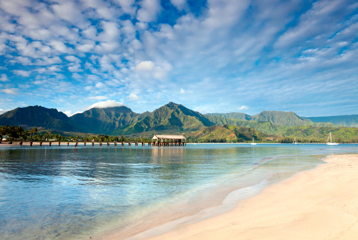 The beach at Hanalei Bay, Hawaii is a must-visit according to travel experts. (Getty)