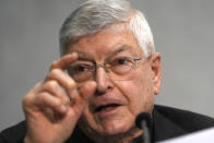 FILE - The Rev. Gianfranco Ghirlanda, a Jesuit professor of theology, talks during the presentation of the long-awaited reform program of the Holy See bureaucracy, during a press conference at the Vatican, Monday March 21, 2022. Pope Francis said Sunday, May 29, 2022 he has tapped 21 churchmen to become cardinals, most of them from continents other than Europe, which has dominated Catholic hierarchy for most of the church's history. (AP Photo/Domenico Stinellis, File)