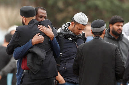 Relatives and other people arrive to attend the burial ceremony of the victims of the mosque attacks, at the Memorial Park Cemetery in Christchurch, New Zealand March 21, 2019. REUTERS/Edgar Su