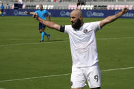 Inter Miami forward Gonzalo Higuain (9) celebrates after an asset on a goal scored by forward Robbie Robinson during the first half of an MLS soccer match against LA Galaxy, Sunday, April 18, 2021, in Fort Lauderdale, Fla. (AP Photo/Lynne Sladky)