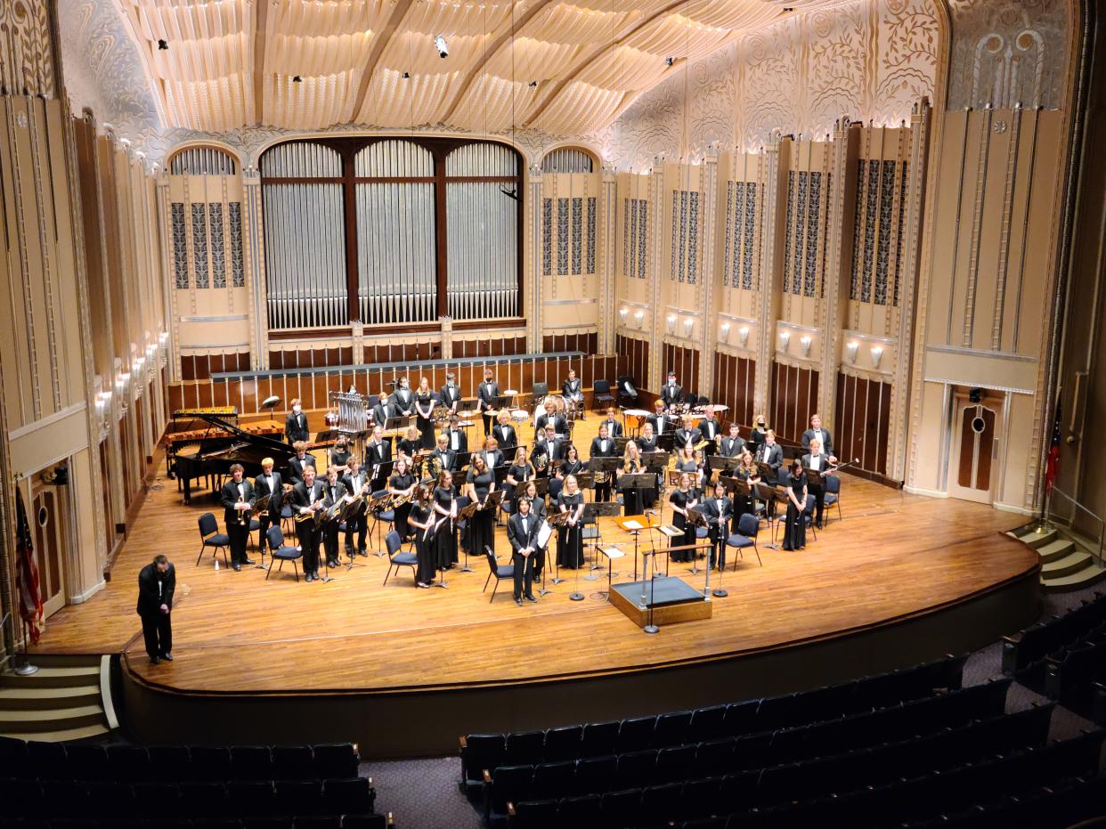 The Wooster High School symphonic band members stand to receive applause after performing Sunday night in the 18th annual Northeast Ohio Band Invitational at Severance Music Center in Cleveland.