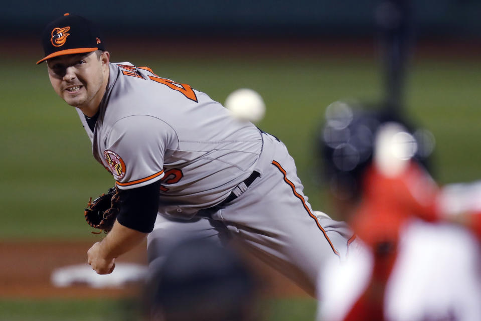 Baltimore Orioles' Keegan Akin watches a pitch to a Boston Red Sox batter during the first inning of a baseball game Tuesday, Sept. 22, 2020, in Boston. (AP Photo/Michael Dwyer)