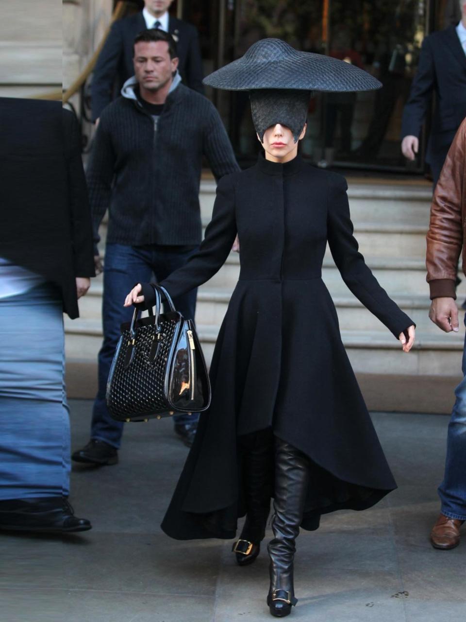 <p>Lady Gaga wearing an Alexander McQueen wave ruffle dress coat leaves the Langham Hotel, London, October 2013. </p>