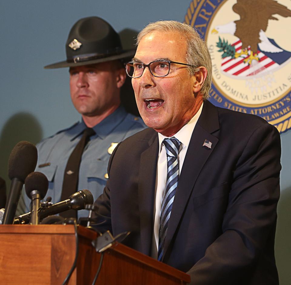 David Weiss, U.S. Attorney for the State of Delaware (right), speaks at a press conference on February 21, 2023 about an effort from several agencies to end a multi-state drug operation.