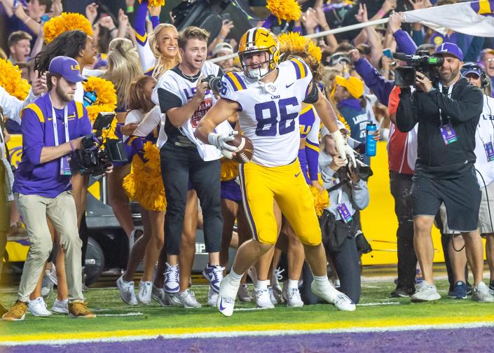 LSU tight end Mason Taylor celebrates after scoring the game-winning two point conversion in overtime against Alabama at Tiger Stadium.