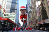 <p>The Elf on the Shelf balloon is led down Sixth Avenue just in time for the holiday season during the 91st Macy’s Thanksgiving Day Parade in New York, Nov. 23, 2017. (Photo: Gordon Donovan/Yahoo News) </p>