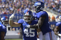 New York Giants' Nate Stupar, left, reacts after a stop during the first half of an NFL football game against the Washington Redskins, Sunday, Sept. 29, 2019, in East Rutherford, N.J. (AP Photo/Bill Kostroun)