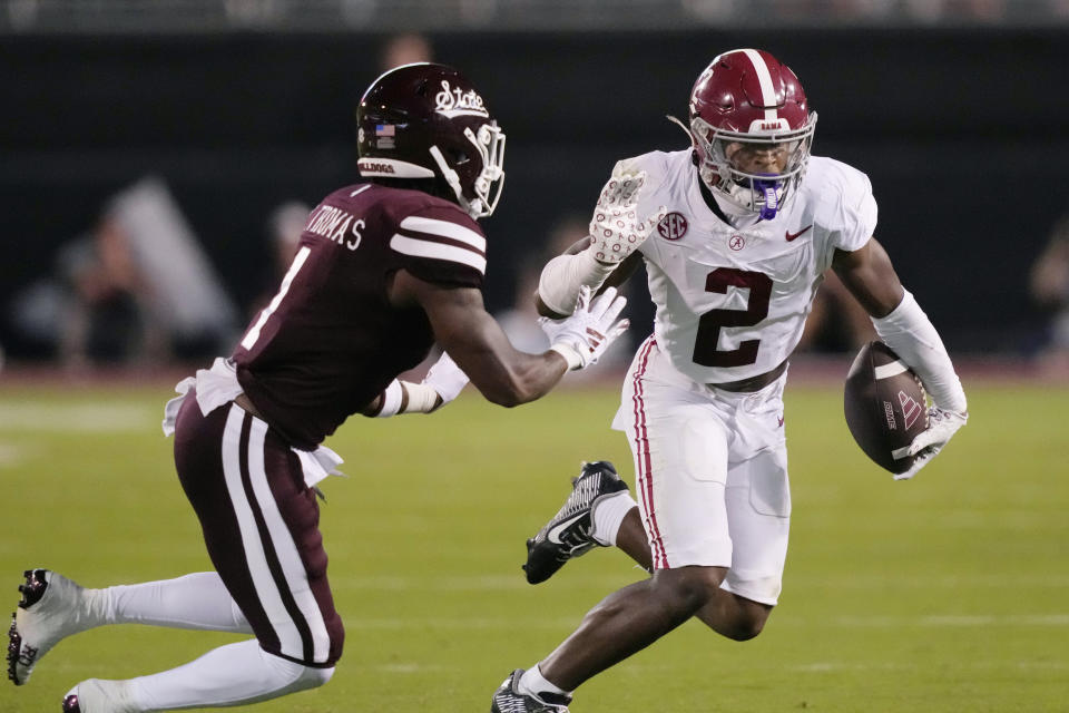 Alabama defensive back Caleb Downs (2) runs back an interception against Mississippi State safety Marcus Banks (1) during the second half of an NCAA college football game, Saturday, Sept. 30, 2023, in Starkville, Miss. Alabama won 40-17. (AP Photo/Rogelio V. Solis)