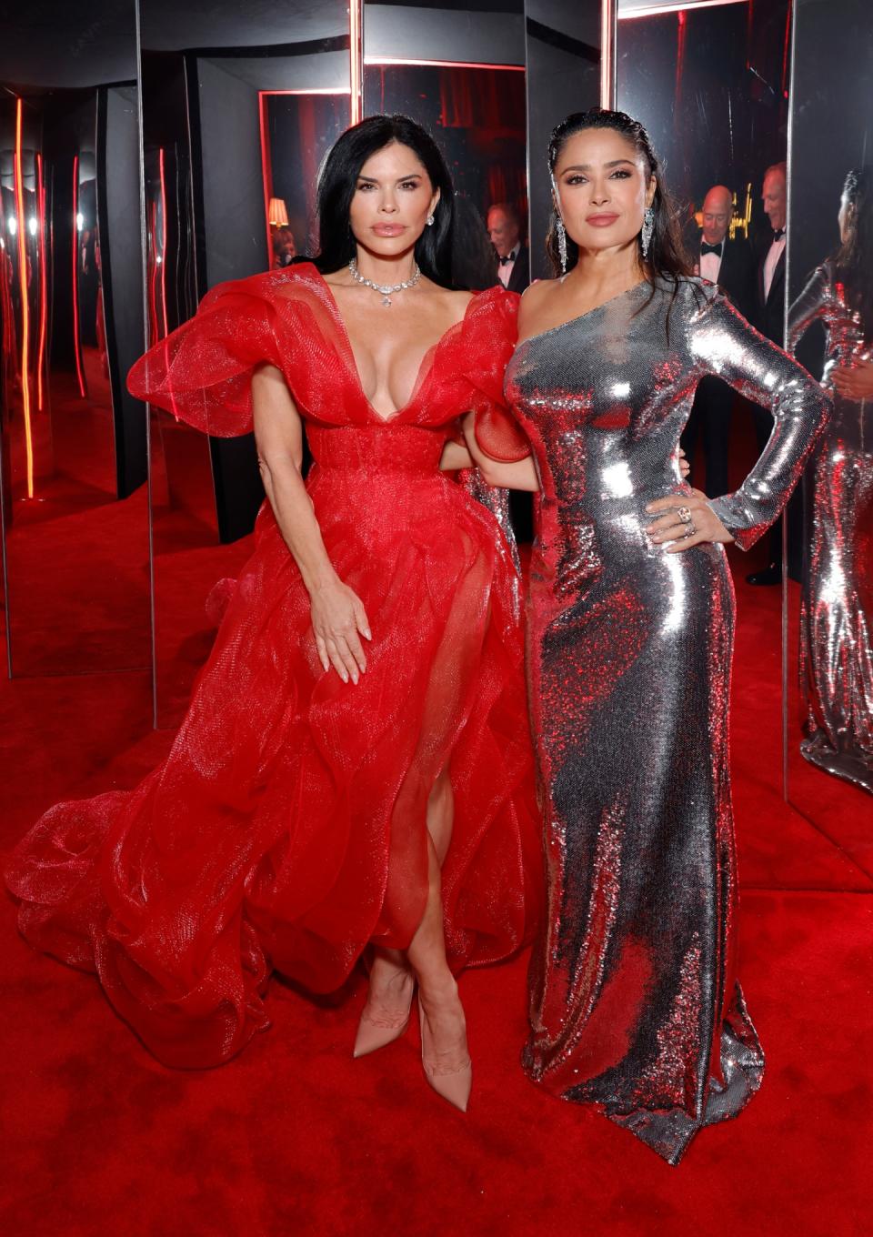 Lauren Sanchez (L), pictured here with Salma Hayek, at the 2024 Vanity Fair Oscar Party held at the Wallis Annenberg Center for the Performing Arts on March 10 in Los Angeles.