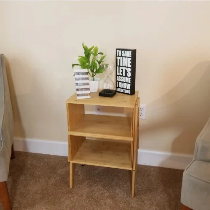 Reviewer's photo of the two tables stacked to make one, two-tiered side table